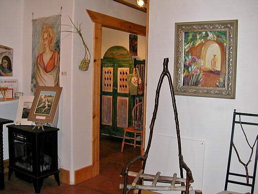 Area of main room divided by floating wall. Traditional cabinet.